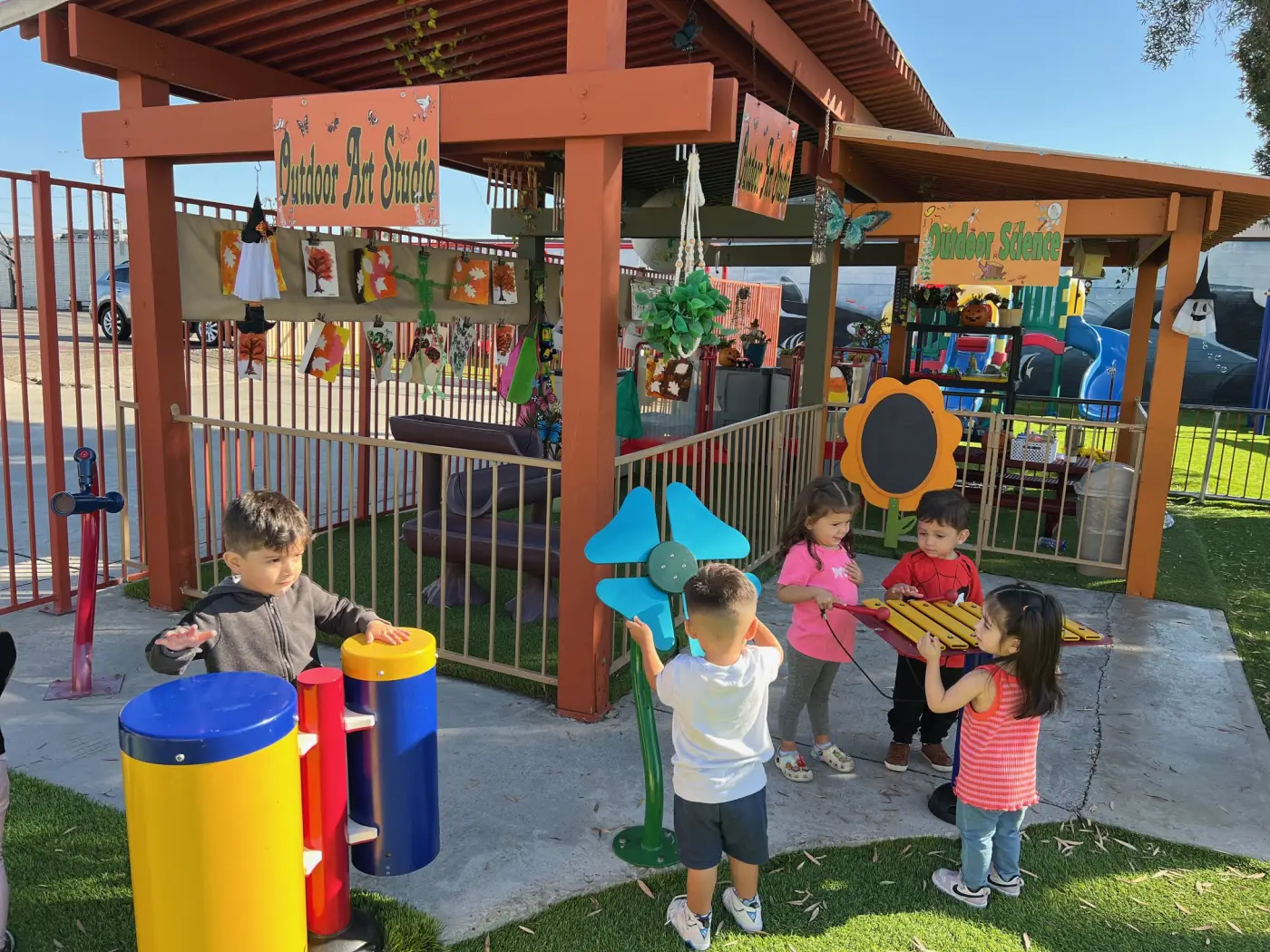 Children playing on an outdoor structure in Fullerton sunshine, the kind of bright-light exposure that researchers have linked to dramatically lower childhood myopia rates