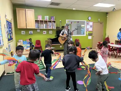 Children participating in dance and fitness enrichment at Kids Adventure Learning Center expressing themselves through movement and creative play