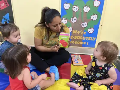 Children in Kids Adventure Learning Center's Spanish-English dual language immersion program learning with a bilingual teacher
