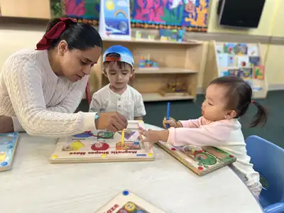Toddlers at Kids Adventure Learning Center ages 18-30 months engaged in creative play-based learning exploration