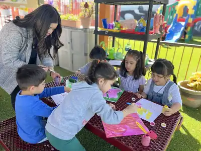 Preschool children enjoying hands-on cooking and science experiments as part of Kids Adventure Learning Center's summer curriculum